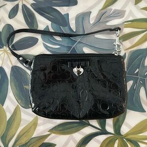 Small black coach clutch